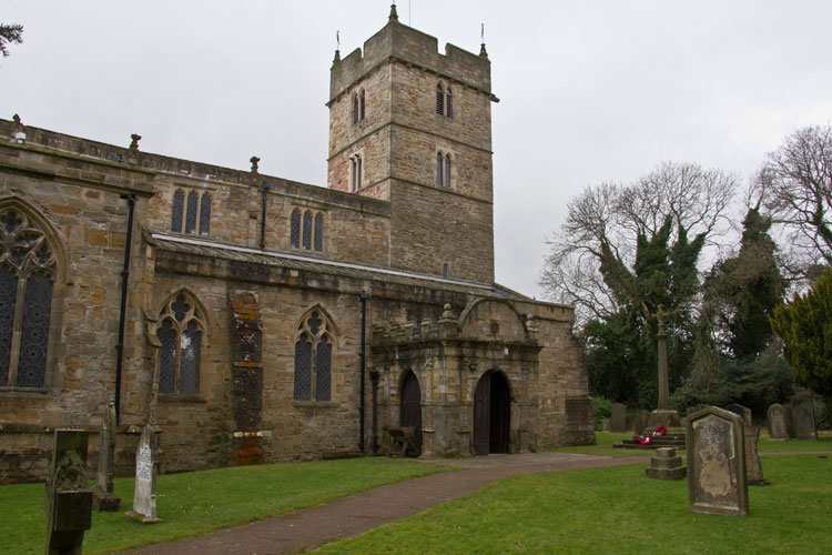 St. Brandon's Church, Brancepeth, with e War Memorial by the Main Entrance