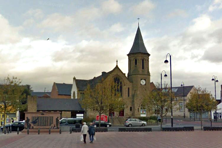 Chester-le-Street's Market Place in front of the Methodist Church and North Burns, with the War Memorial on the left.