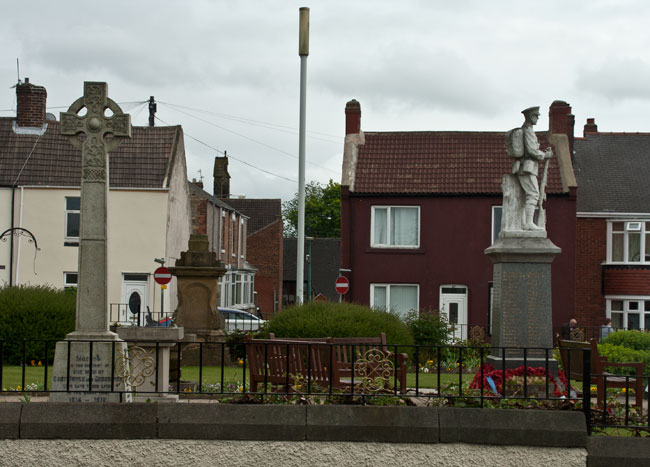 Left, - The War Memorial for East Knowle and Crossings, Ferryhill (County Durham), with the War memorial for Ferryhill itself on the right.