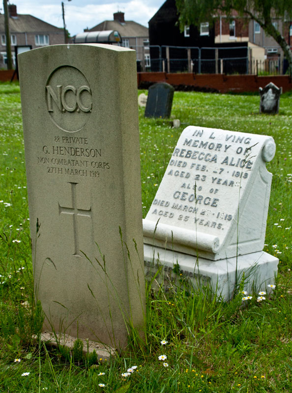 The grave of Private G Henderson of the Non Combatant Corps, in front of the family headstone.