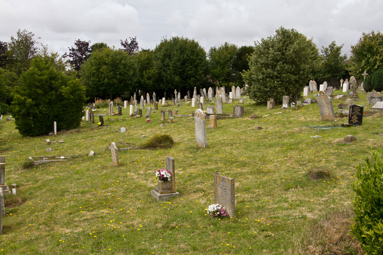 Dorchester (Fordington) Cemetery. Private Hand's grave is on the left, beside the bush.