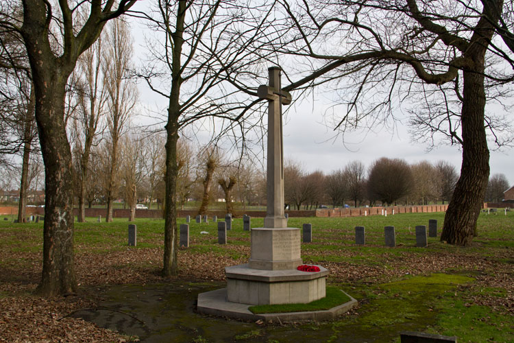 The Cross of Sacrifice in North Ormesby (St. Joseph's) Roman Catholic Cemetery with several of the Commonwealth War Graves behind it. To the left of the cross, in the distance are the headstones which include that of Private Kelly and where Private Leahy is buried.