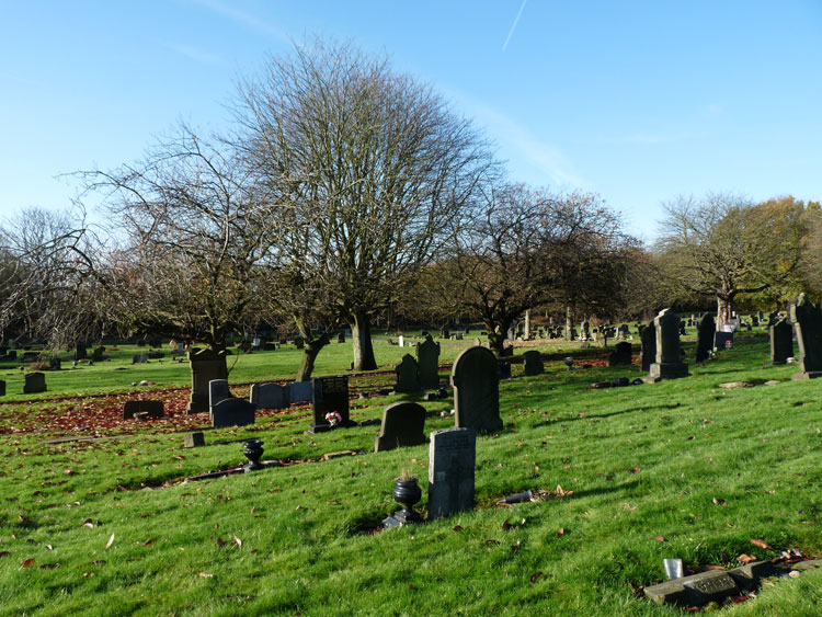 Private Corfield's headstone in Wigan Cemetery - centre foreground