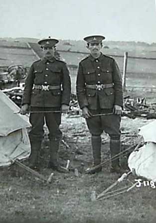 Two soldiers of the Yorkshire Regiment standing between two tents. James is on the left (small 'x' over his head).