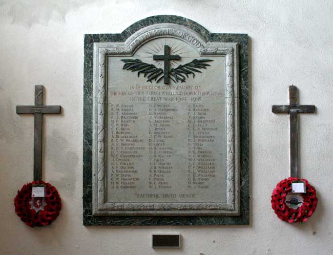 The War Memorial inside the entrance of All Saints' Church, Lydd (Kent). Beside the memorial tablet are two crosses from the original graves in which the soldiers were interred