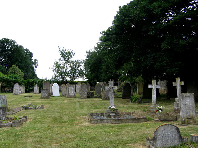 Morcott Churchyard, - Edmund Joyce's grave is the white headstone towards the rear.