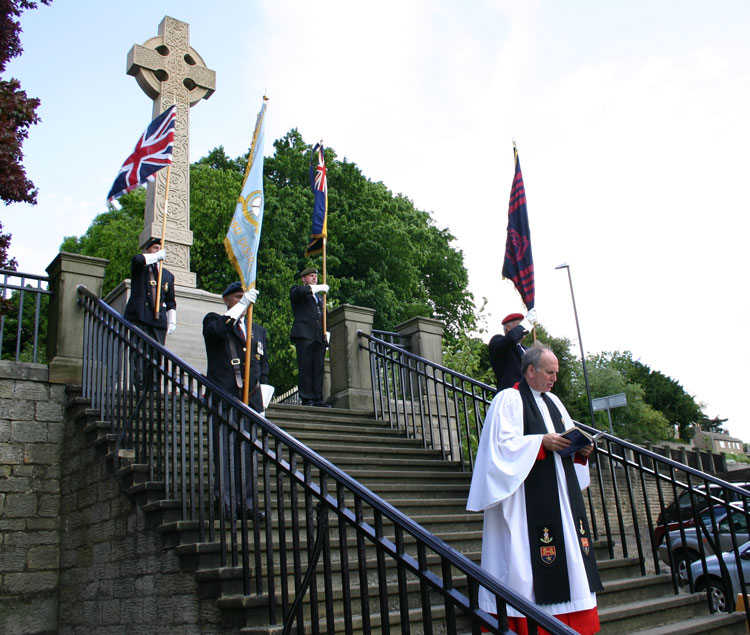 The War Memorial in the Friary Gardens, with Standard Bearers of the British Legion at the service for the Commemoration of D-Day in 2004.