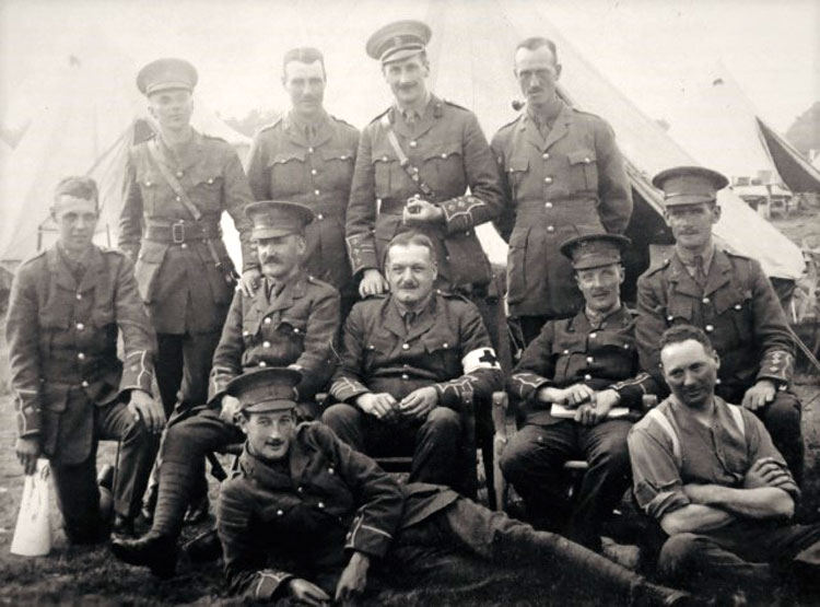 William Whitesmith Constantine, in camp, date unknown (seated far right)>