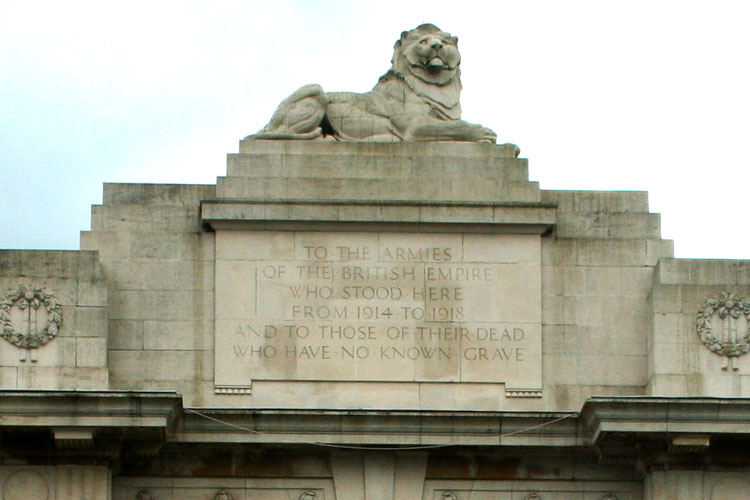 One of the Lions at the top of the Menin Gate Memorial, with the Memorial Dedication 