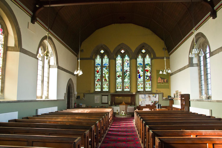 The West End of St. Matthew's Church, Newbottle, Showing the First World War Memorial and the Memorial Windows.