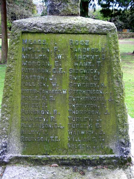 One of the side panels on the Eston Cemetery War Memorial, showing significant damage to the lettering.